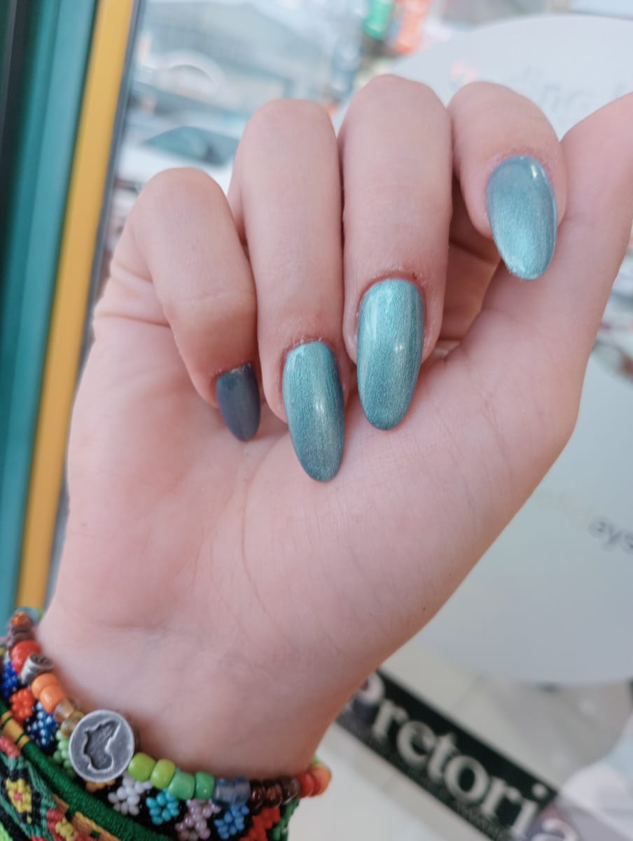 Metallic teal soft gel tips with a darker accent nail