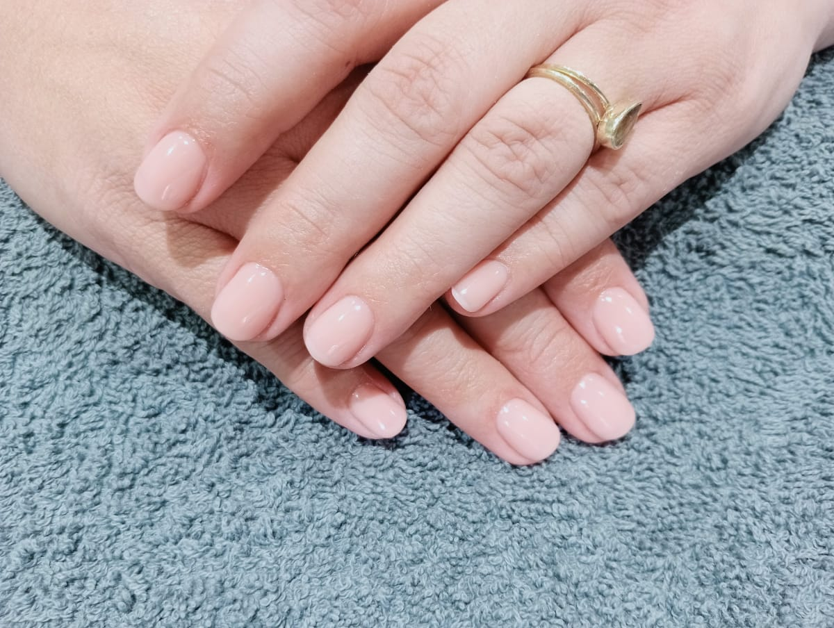 Natural nude glossy acrylic overlay on short nails