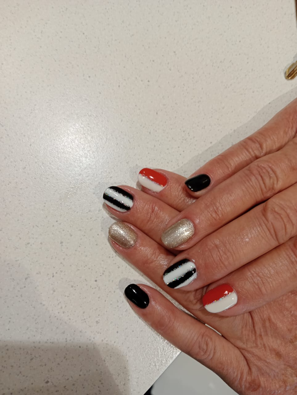 Bold red black white and gold striped gelish nail art