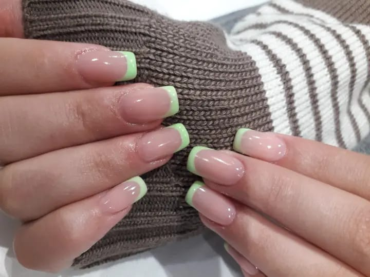 Nude soft gel tips with pastel green French edges
