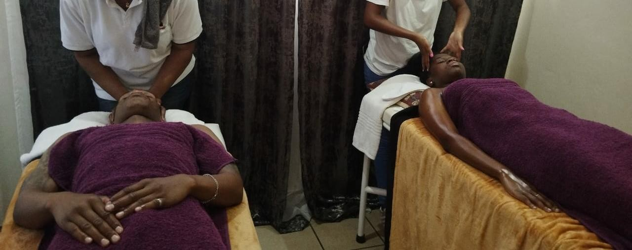 Couples facial massage side by side at Beauty by BM spa