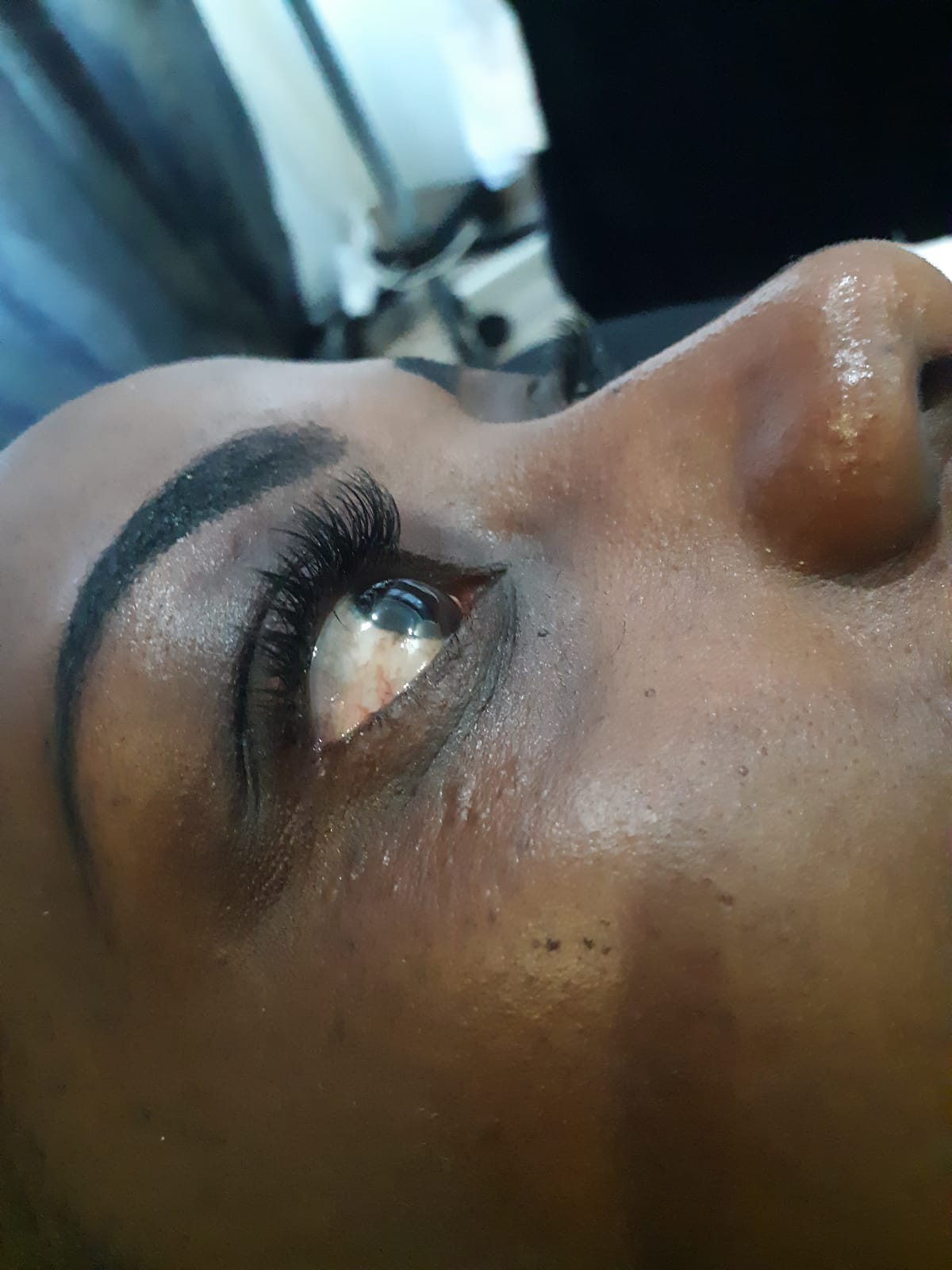 Detailed brow tint and lash extension side profile