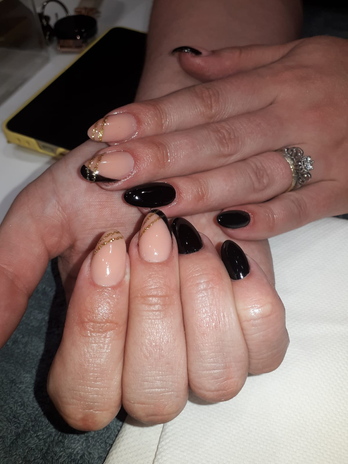 Black and nude soft gel tip set with gold line detailing