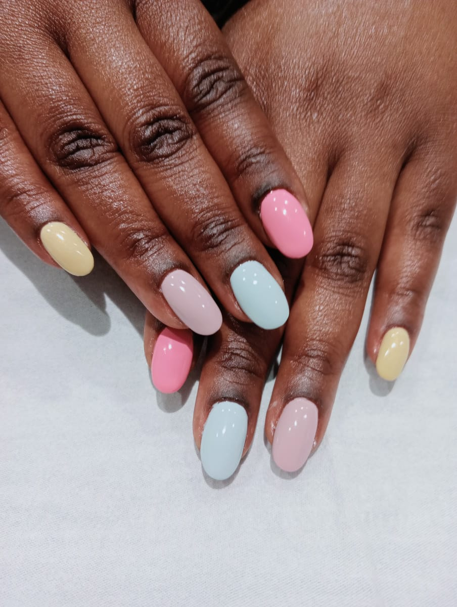Pastel multicolour acrylic overlay on almond nails