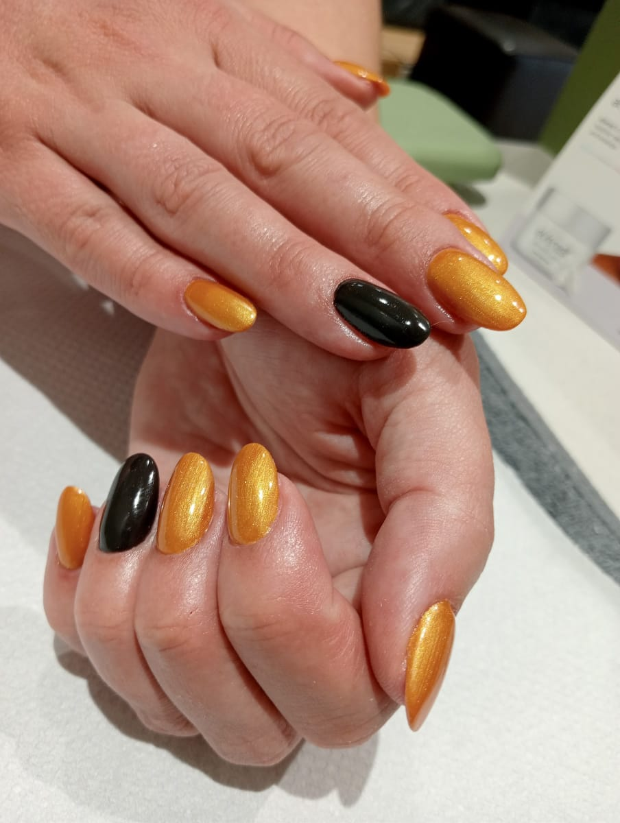 Golden amber soft gel tips with black accent nails
